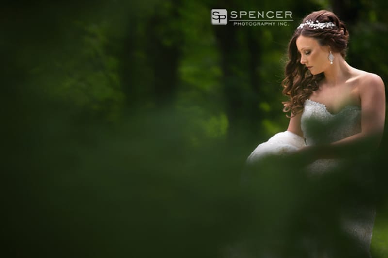 bride posing in woods
