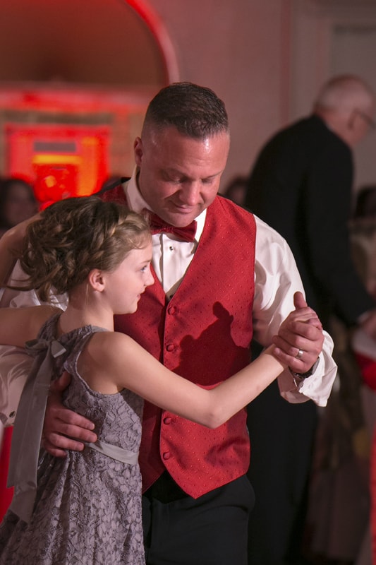 groom dancing with daughter at guys