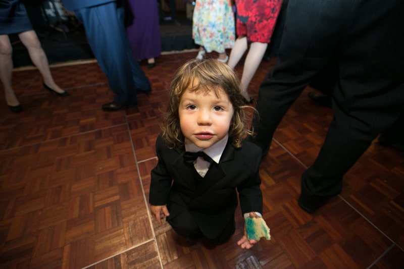 little boy at wedding reception 