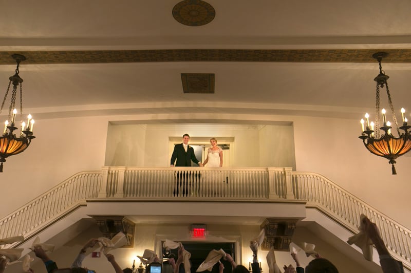 bride and groom enter their wedding reception at greystone hall