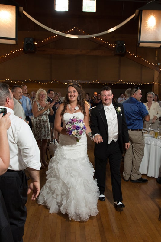 bride and groom enter their wedding reception at columbia ballroom