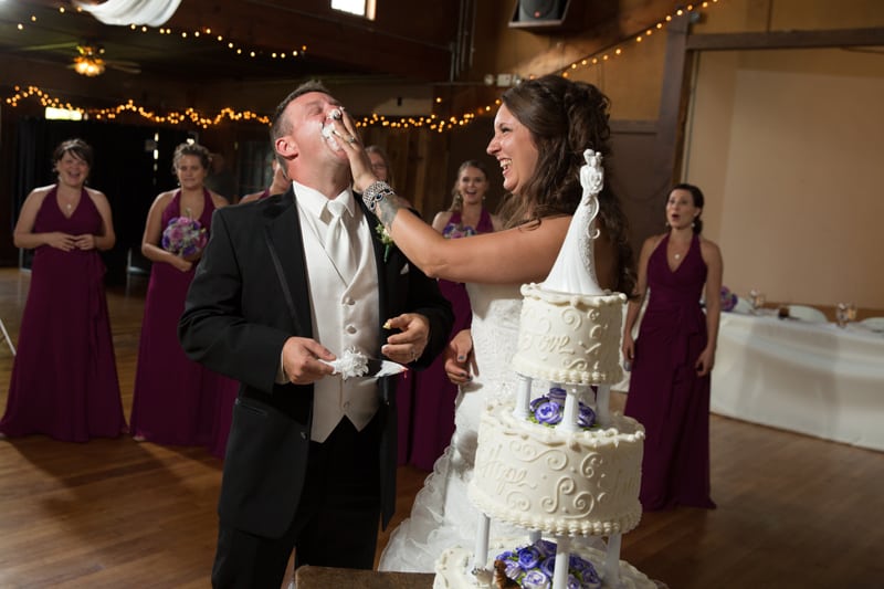 bride smashes cake in grooms face