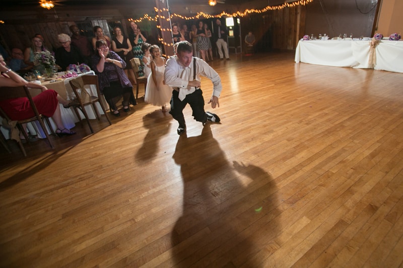 groom dancing at his wedding reception 