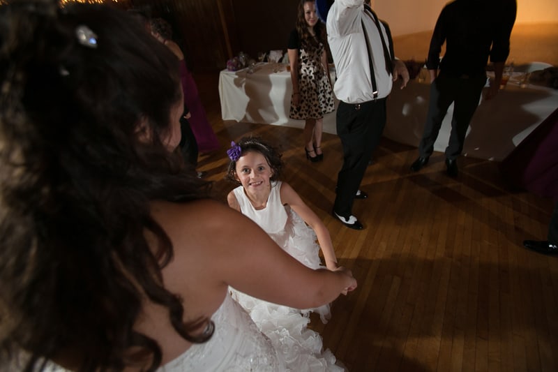 flower girl dancing with bride