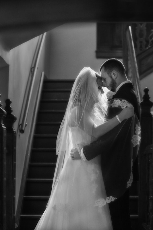 bride and groom picture on staircase