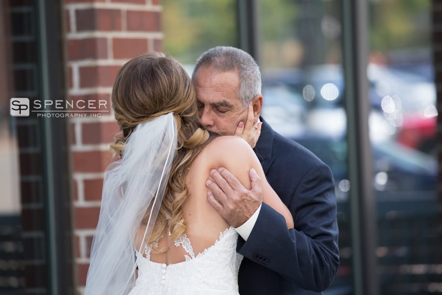 bride hugging dad on her wedding day in akron