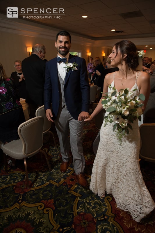 bride and groom enter wedding reception at chagrin valley athletic club