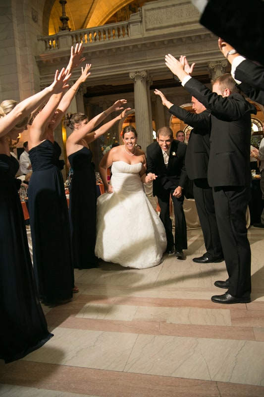 bride and groom enter their wedding reception at cleveland old courthouse