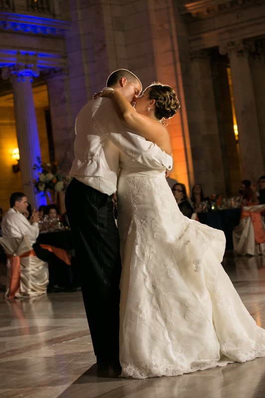 bride and groom kiss at their wedding reception at cleveland old courthouse