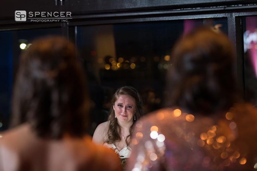 bride reacting to bridesmaid speech