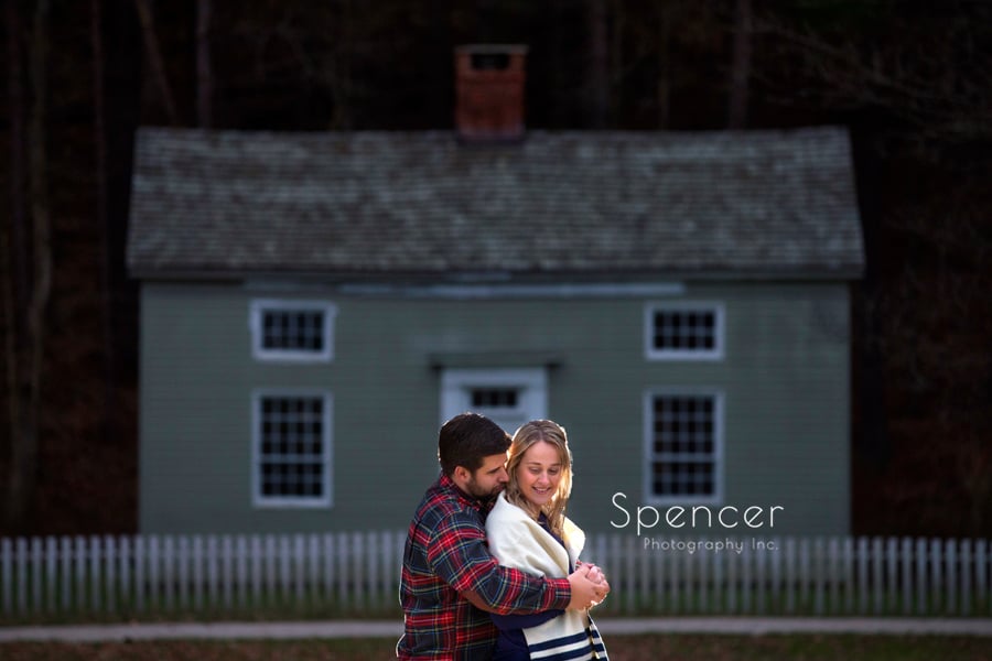 couple hugging in front of house a hale farm and village