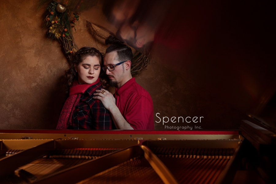 engagement picture of couple and a piano