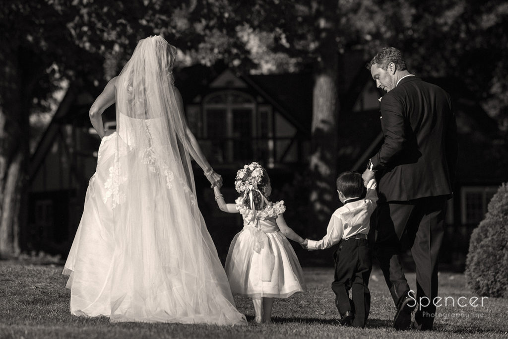 bride and groom with flower girl and ring bearer at Parker Barn wedding ceremony