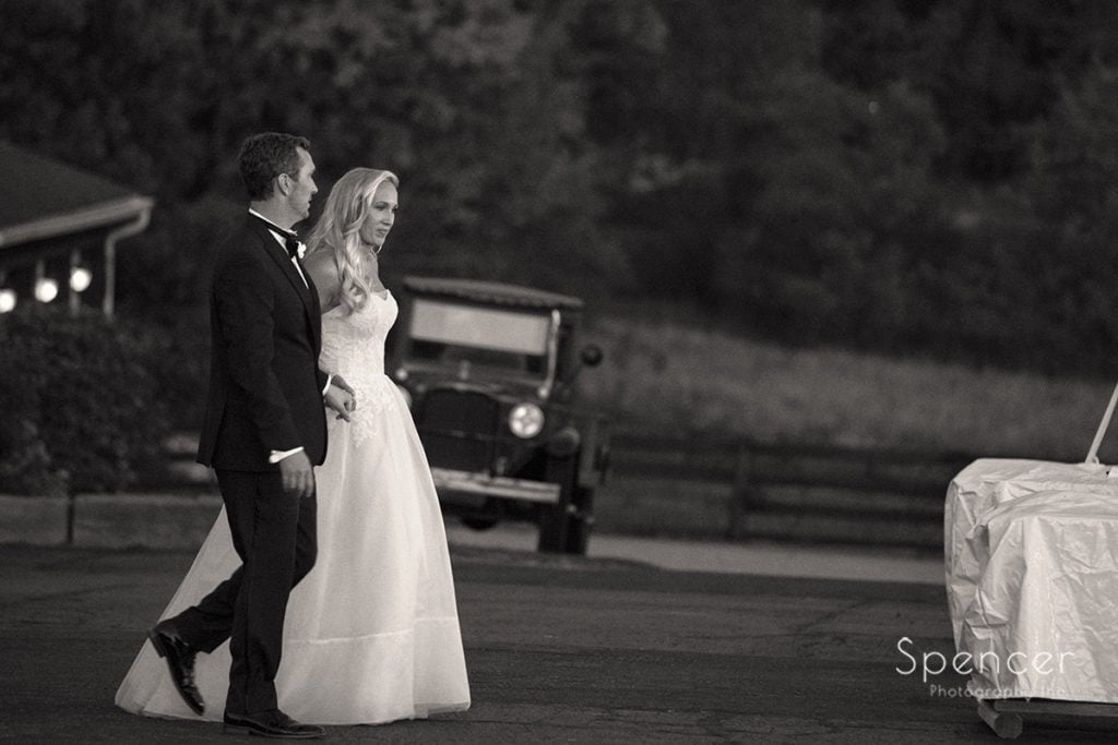 bride and groom walking to their wedding reception at Parker Barn