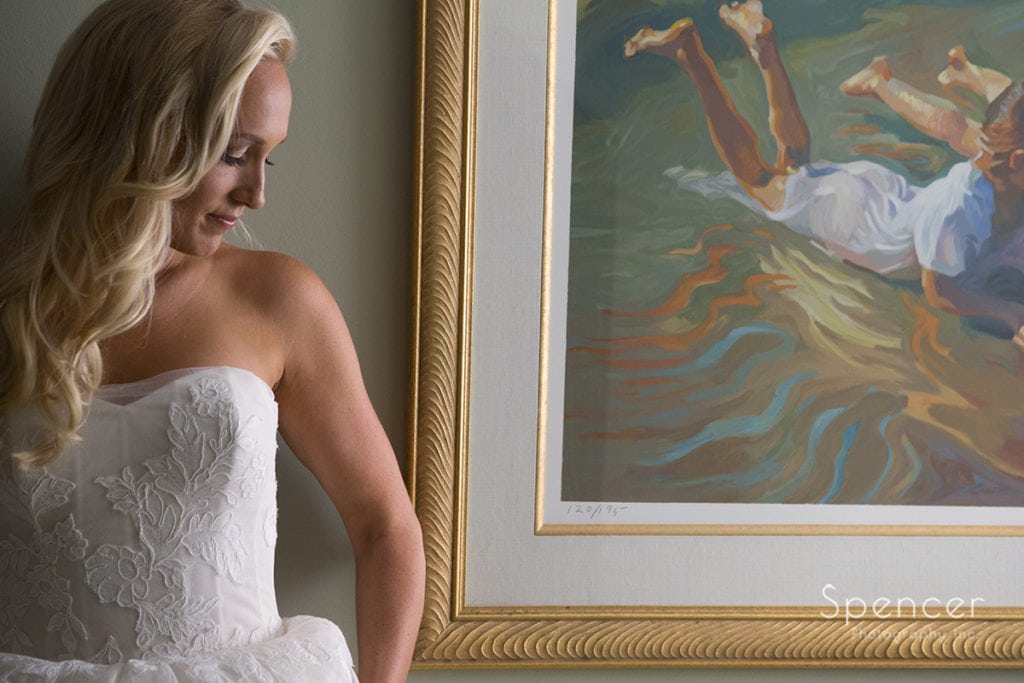 bridal portrait of bride in front of artwork