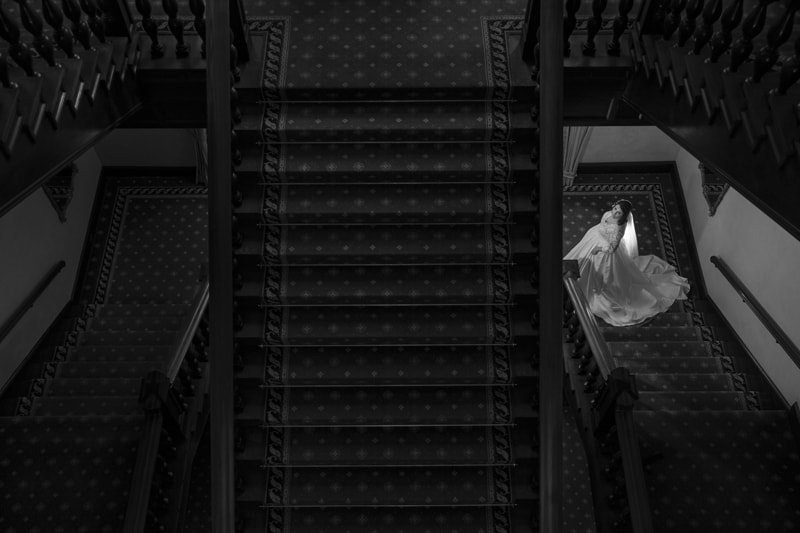bride on stairs of union club of cleveland wedding
