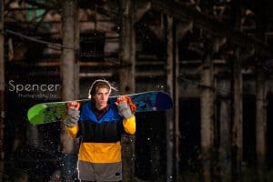 senior picture with snowboard