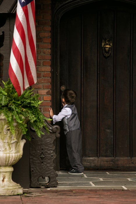  little boy at front door of club at hillbrook