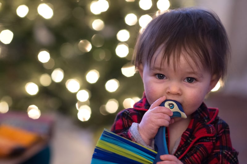  baby in front of christmas tree