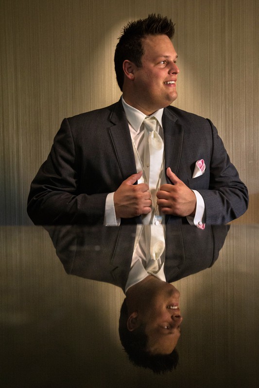 groom portrait with reflection