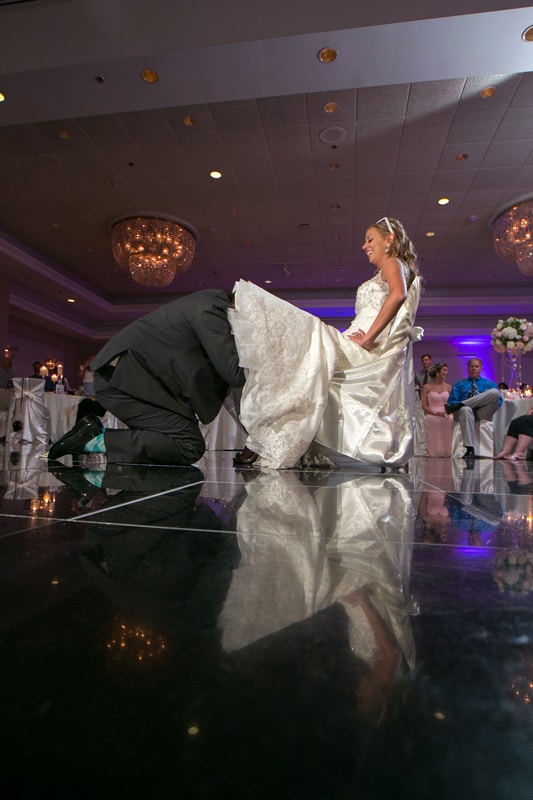 groom removes brides garter