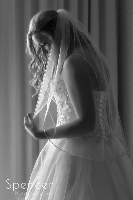 bride adjusting veil