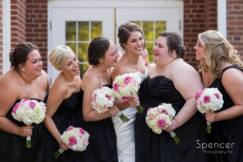  bridesmaids laughing with bride at Canton wedding
