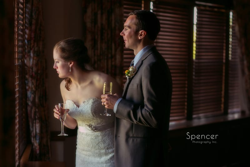  bride and groom waiting to enter their wedding reception at Mayfield Country Club
