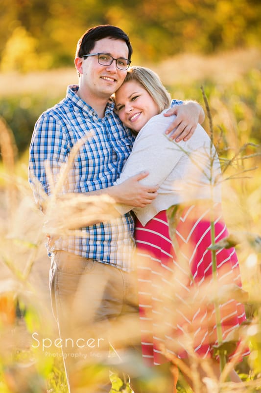 couple hugging during their engagement session in akron merriman valley