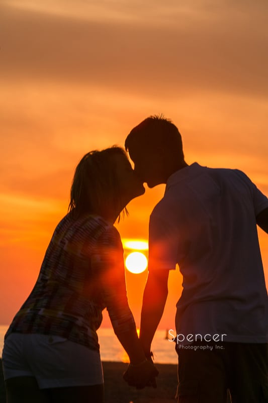 couple kissing at sunset during cleveland engagement session