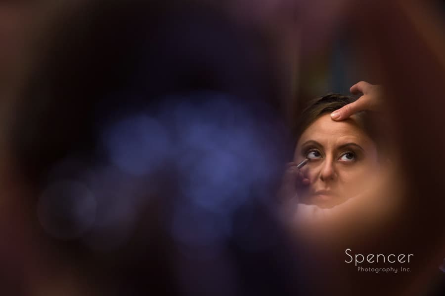abstract picture of bride getting make up for wedding in Akron