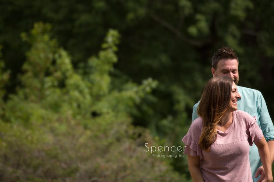 couple laughing during akron engagement photos