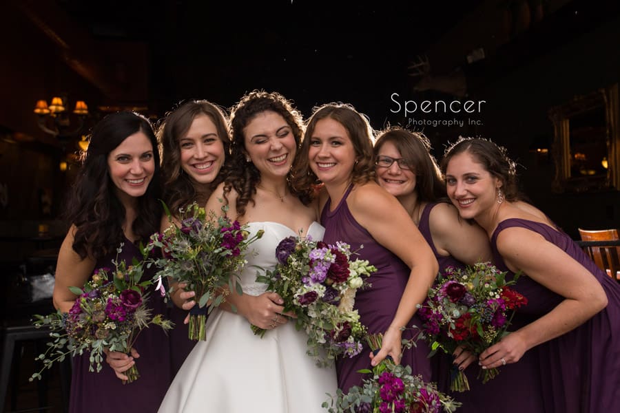  bridesmaids on wedding day outside of Baxters Akron