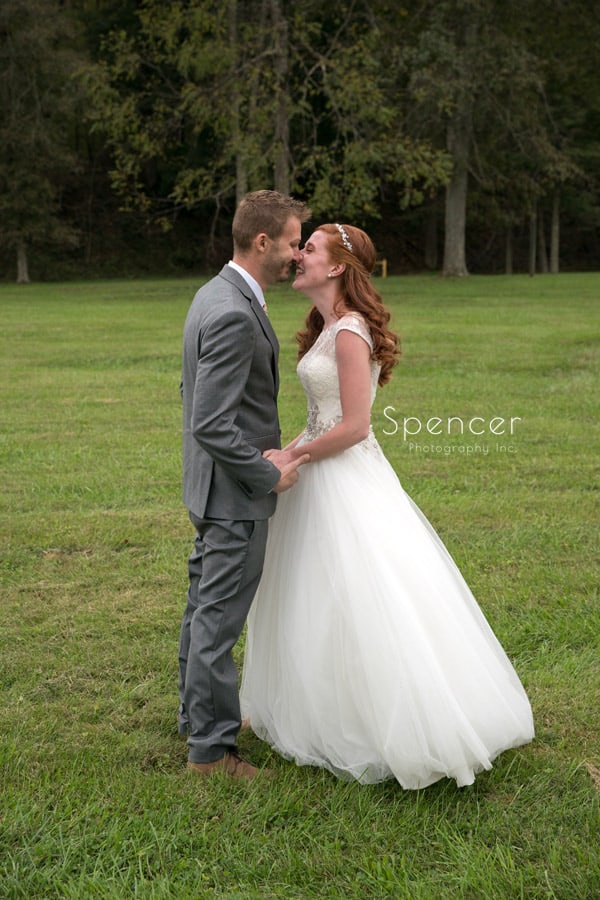 bride and groom kissing after first look