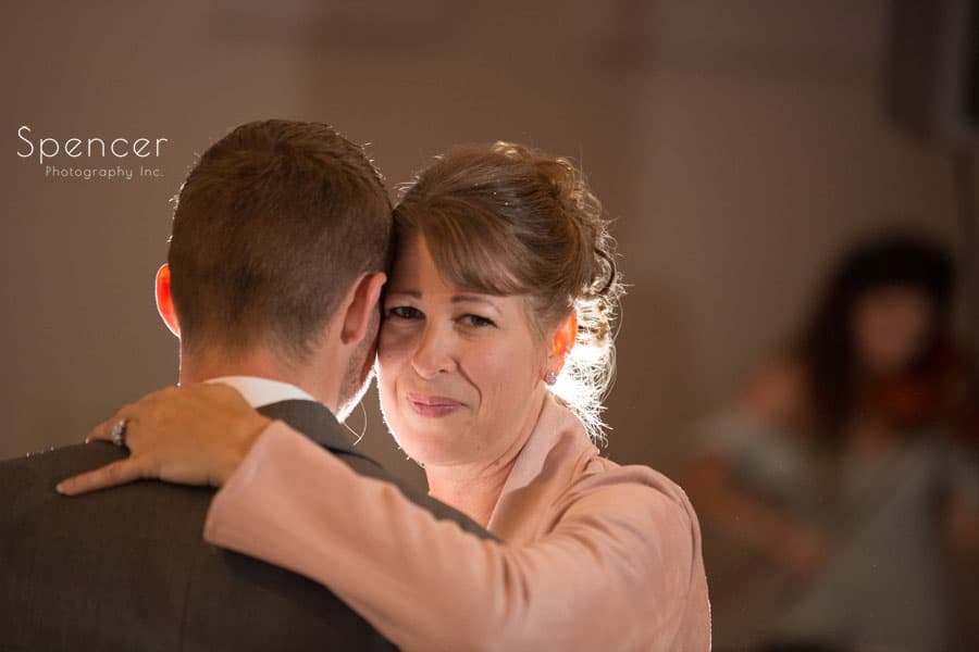 mom dancing with groom