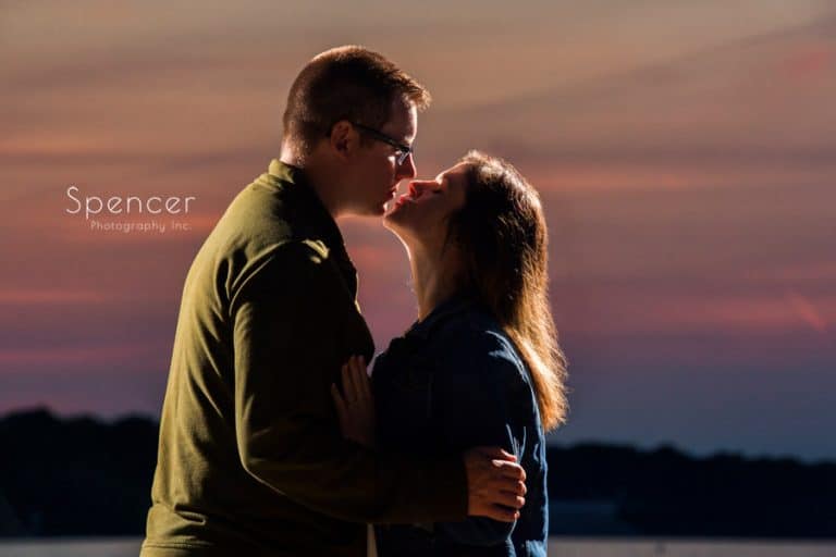 couple kissing at their engagement session on Lake Erie Cleveland