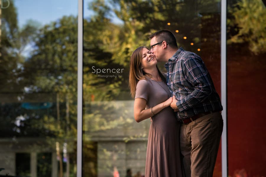 man kissing woman during engagement pictures at cleveland museum of art