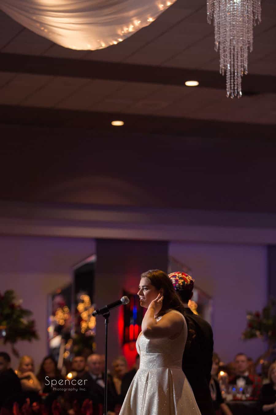 bride giving reception speech at wedding reception at landerhaven
