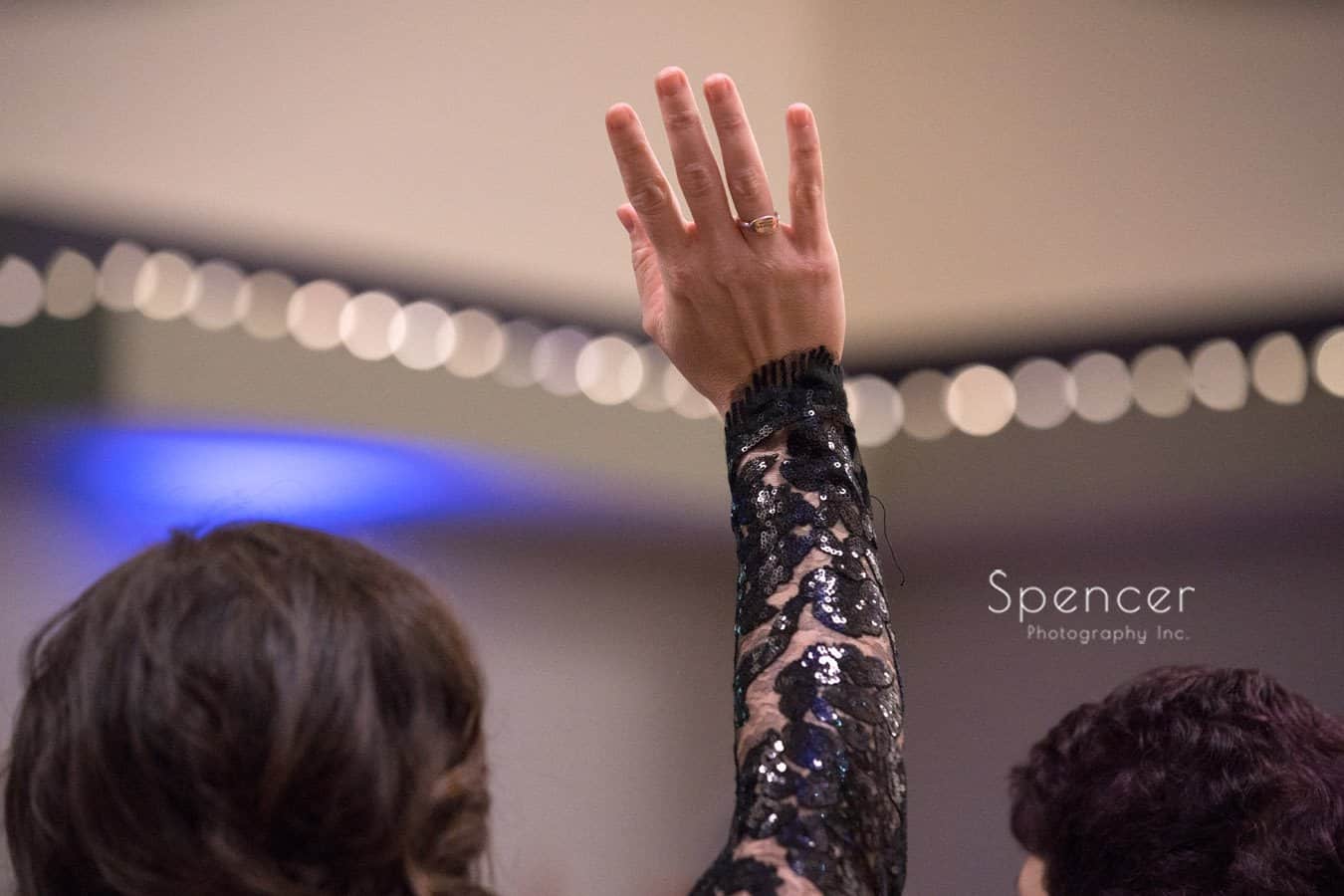 woman raises hand at wadsworth event