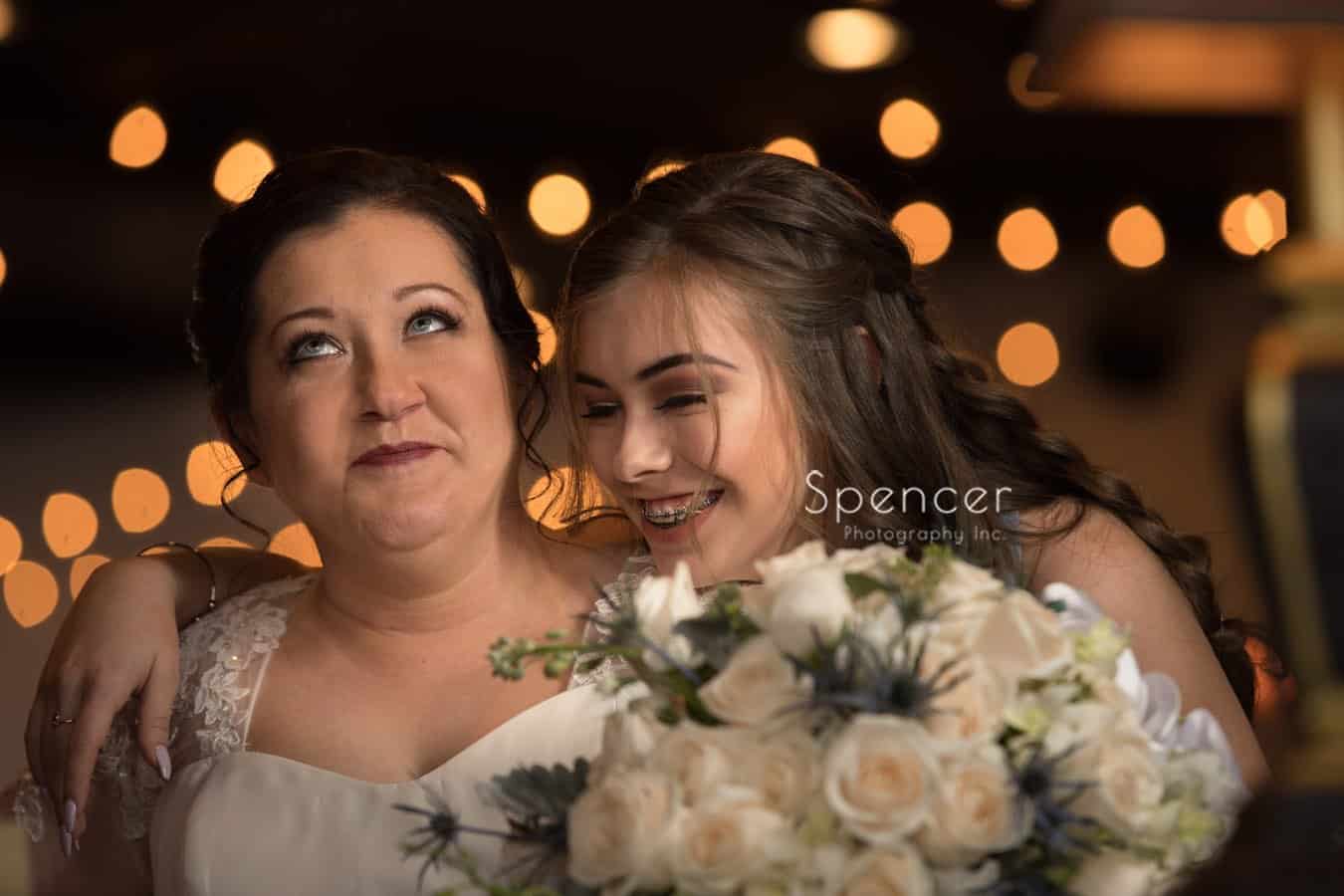 bride and daughter laugh in picture at Vosh Lakewood