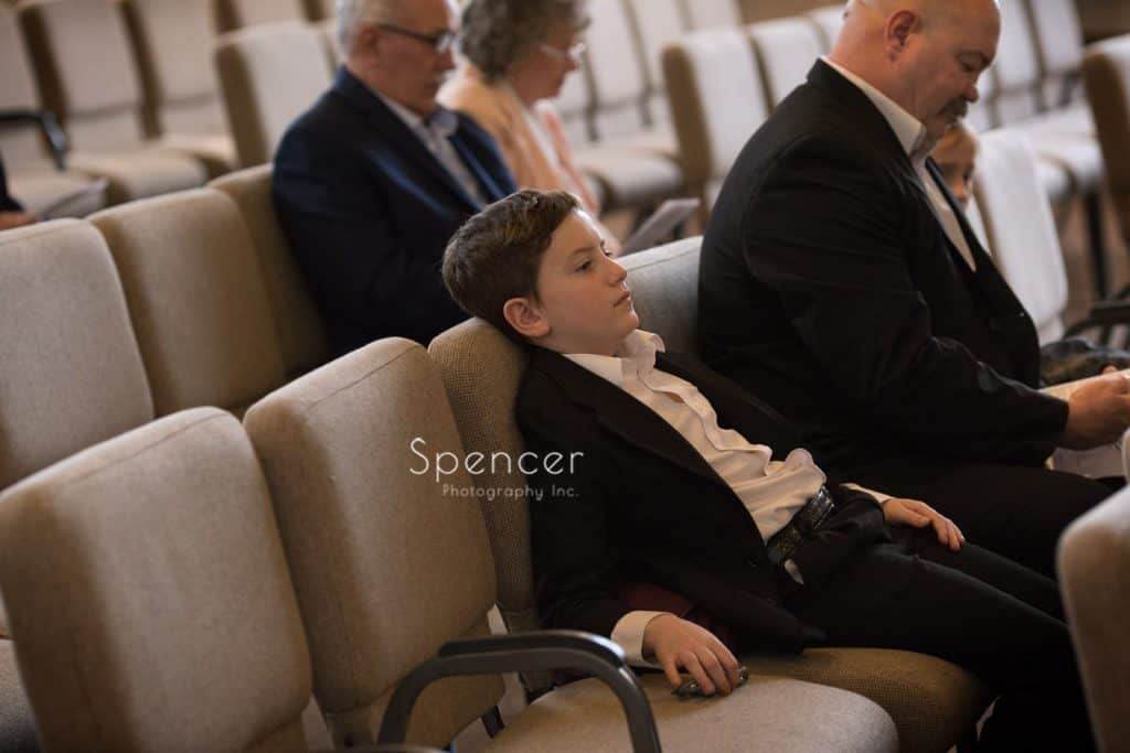 young boy watching wedding ceremony at Lakewood United Methodist Church