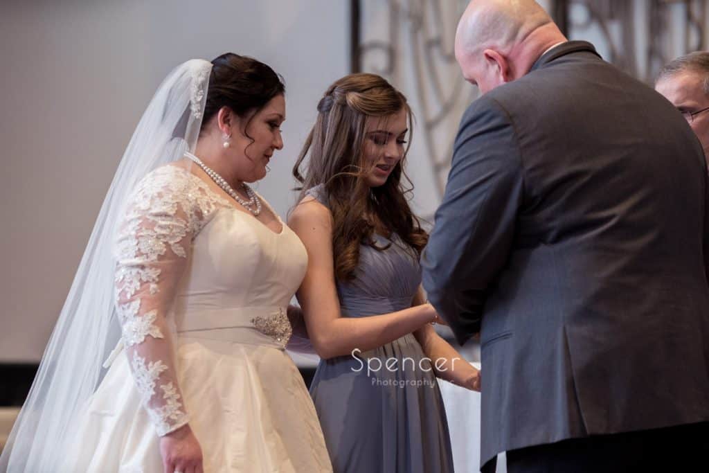 groom presenting daughter with wedding gift