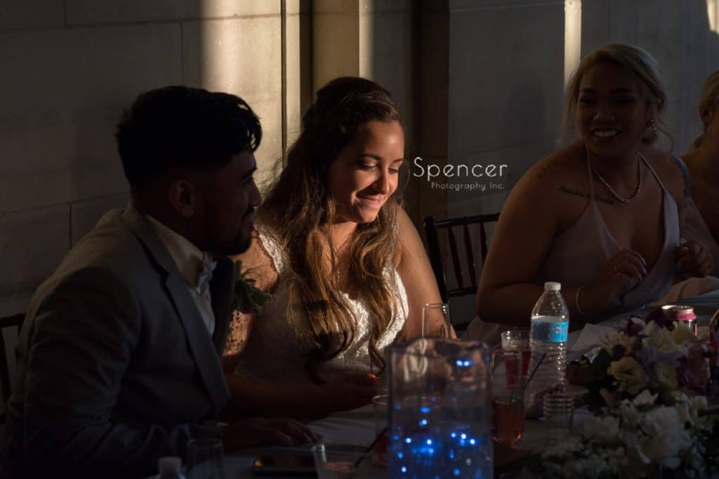 bride smiling at reception table at Ariel Pearl