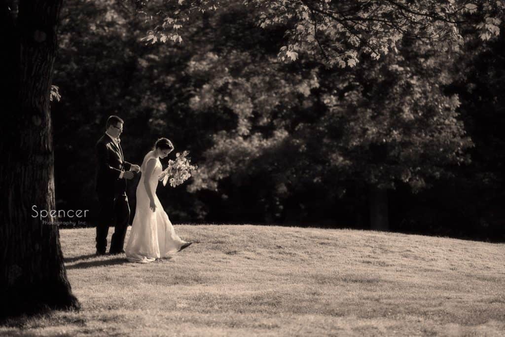 bride and groom walking on gold course at Columbia Hills Country Club