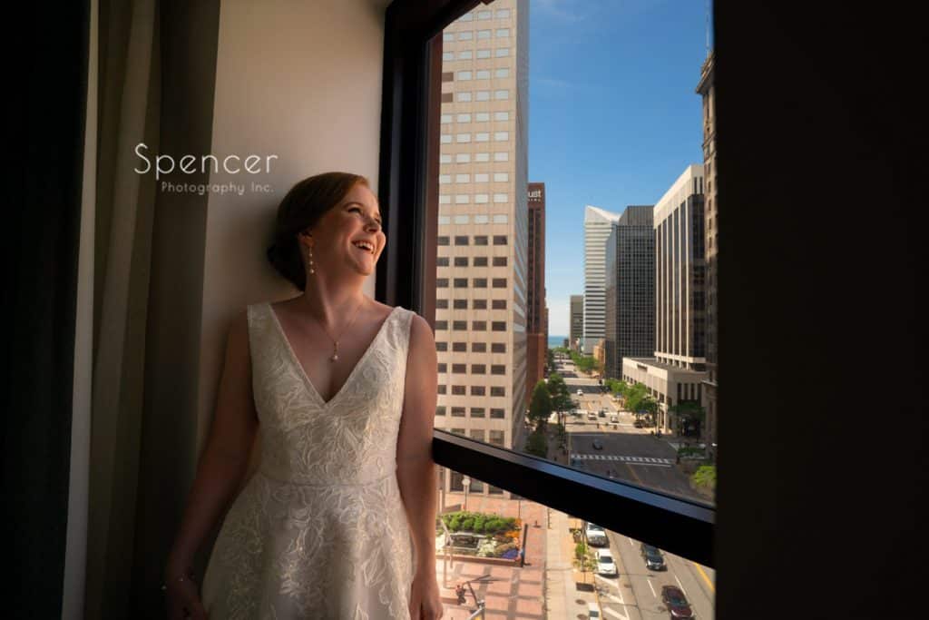 bride laughing in wedding picture atKimpton Schofield Hotel Cleveland
