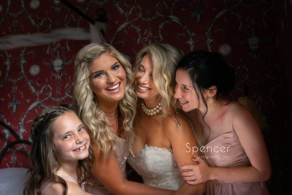 bride laughing with bridesmaids at The Bertram
