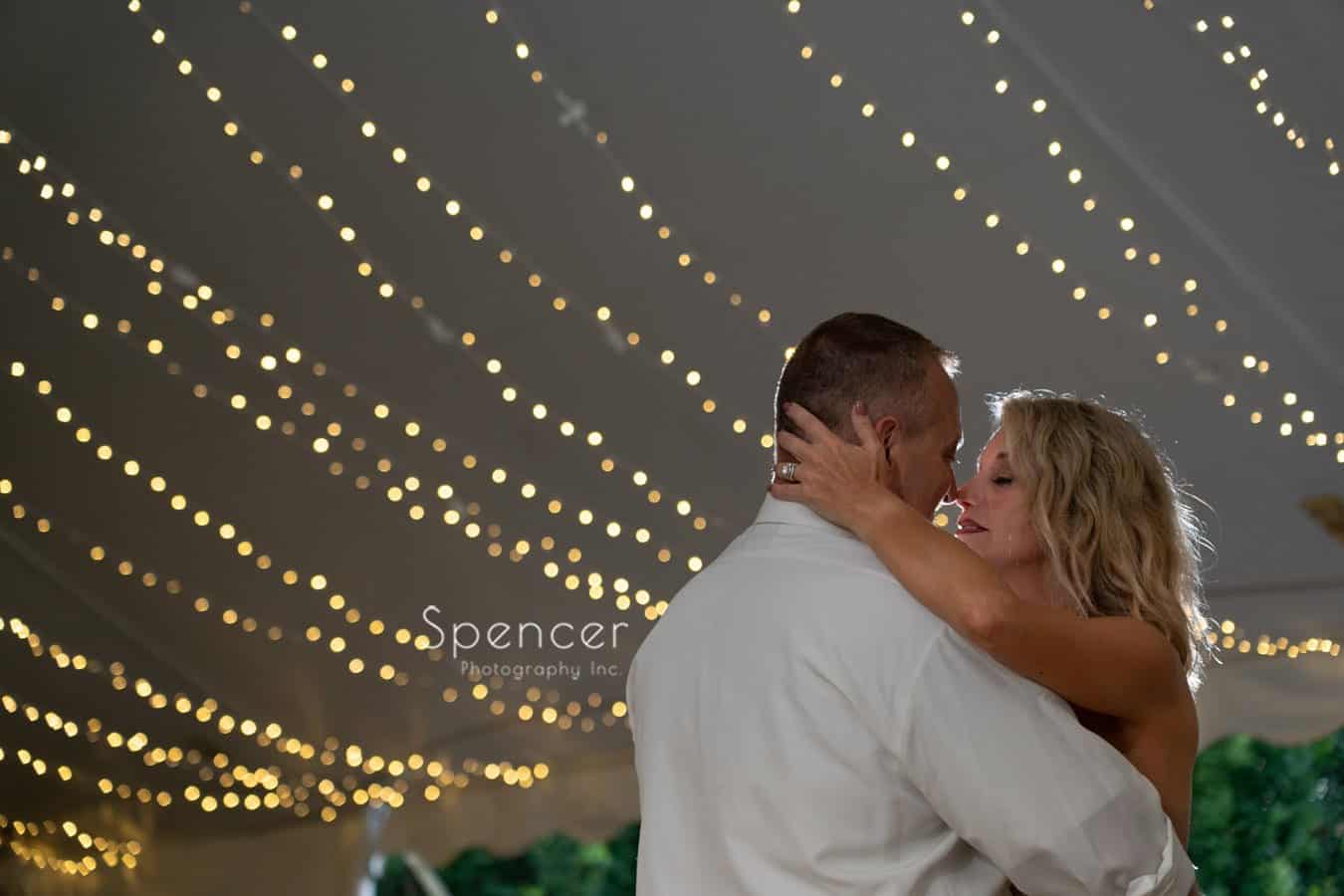 bride kissing groom after first dance at Thorncreek wedding reception