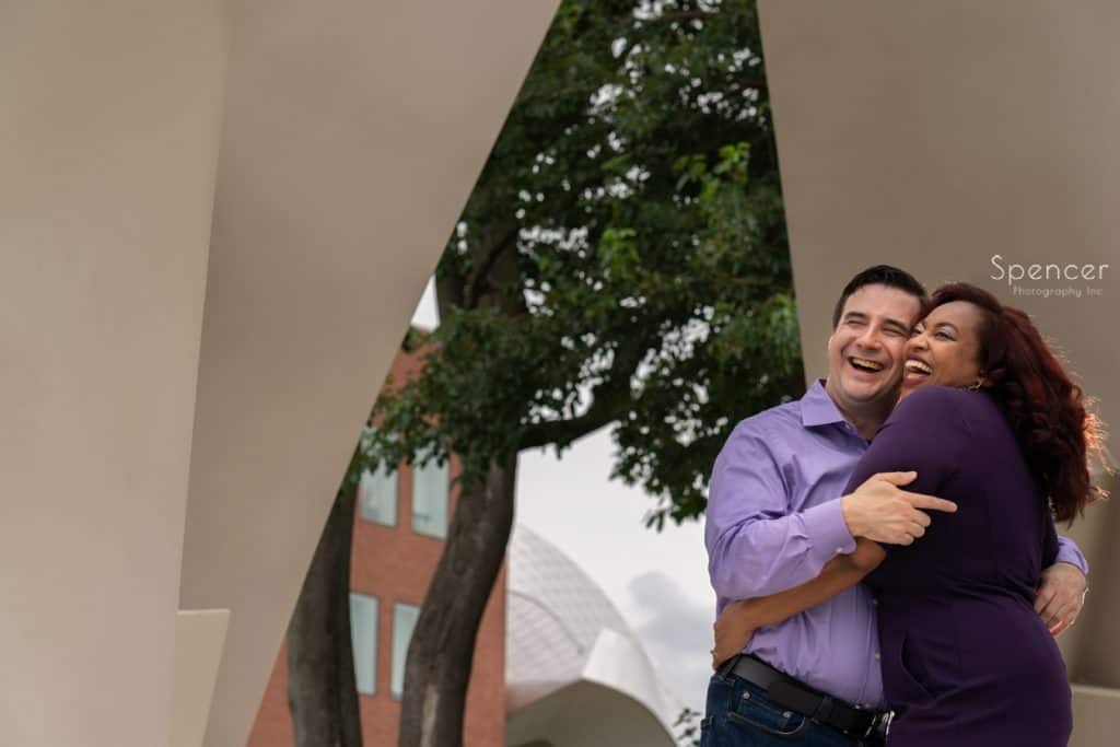couple laughing under sculpture at Case Western Reserve