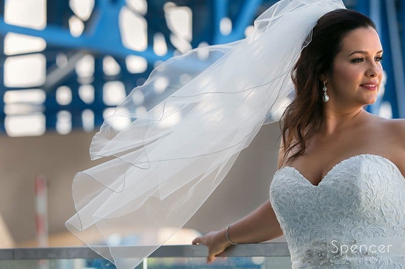 wind blowing bride's hair outside of Aloft Cleveland