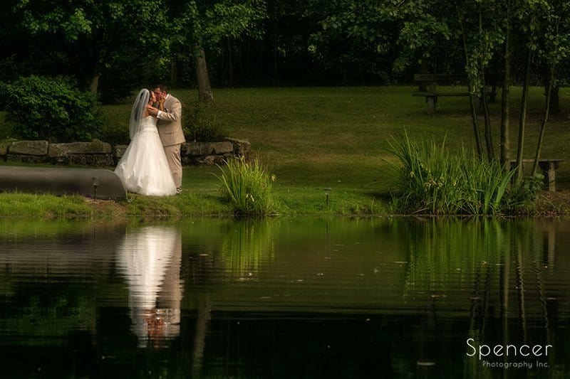 wedding picture of bride and groom by pond at Country Cottage and Gardens